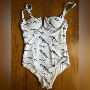 Adorable T-Rex skeleton one piece suit